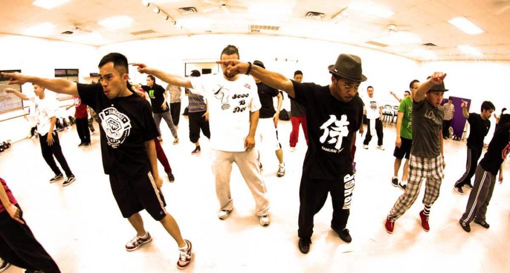 photography of locking dancers practicing